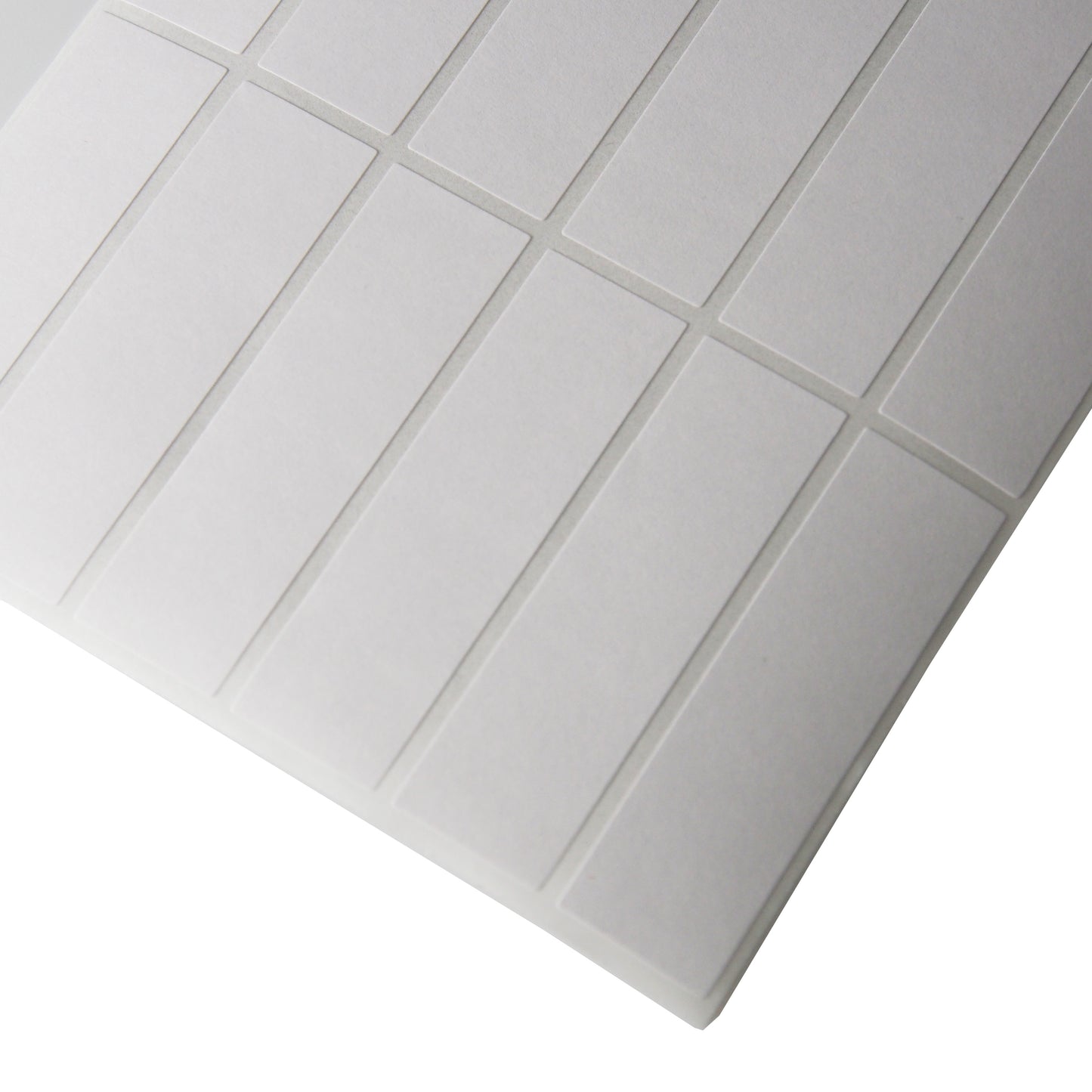 Corner of a sheet of Vertical Rectangular Self Adhesive Plain Labels - 1000 Labels/Pack (1/2" x 1 3/4")