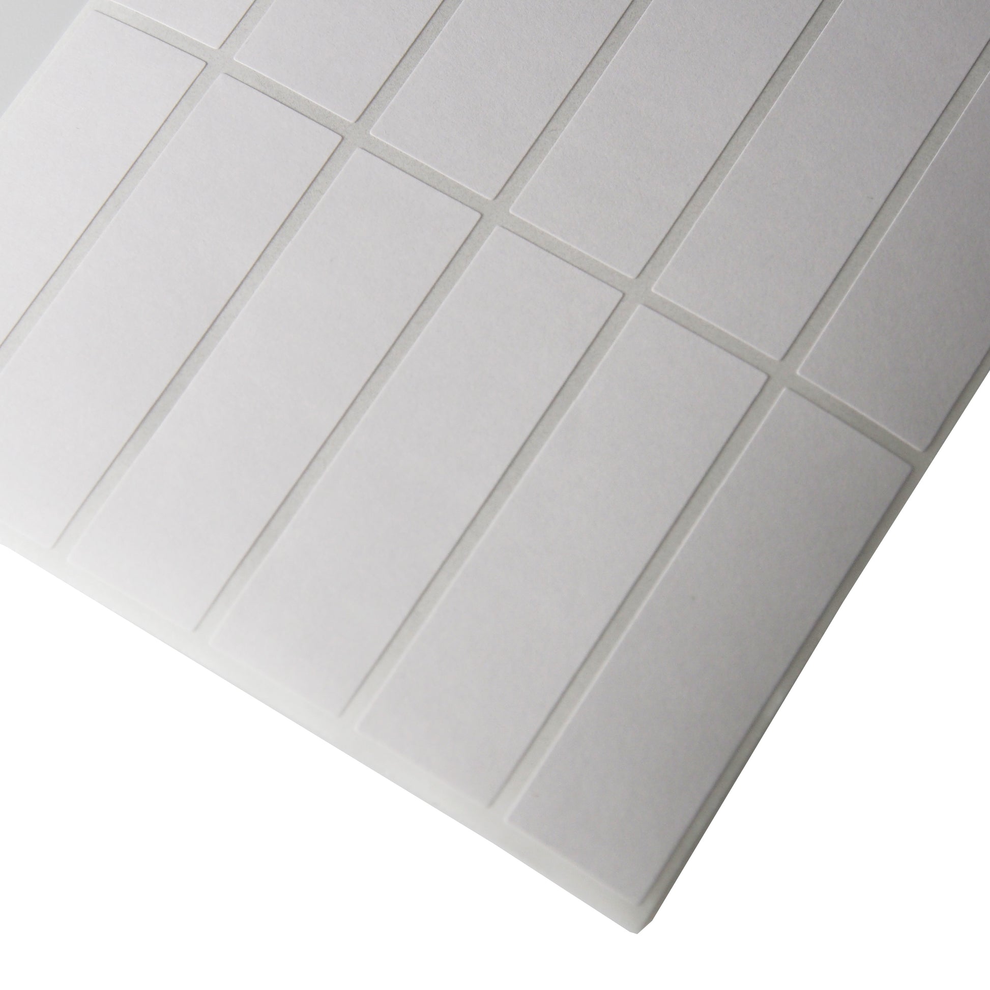 Corner of a sheet of Vertical Rectangular Self Adhesive Plain Labels - 1000 Labels/Pack (1/2" x 1 3/4")