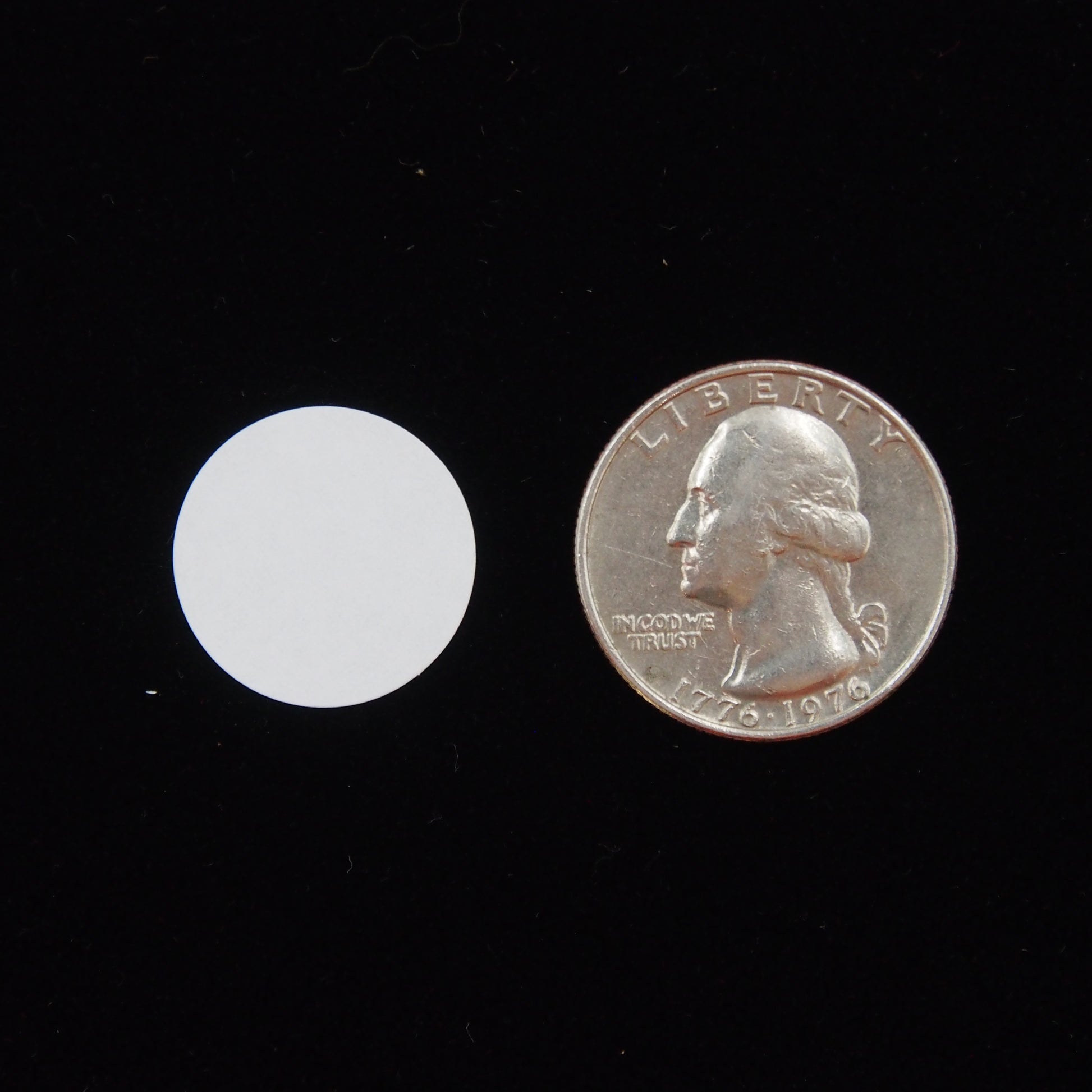 Circle Self Adhesive Plain Label, next to a U.S. Quarter