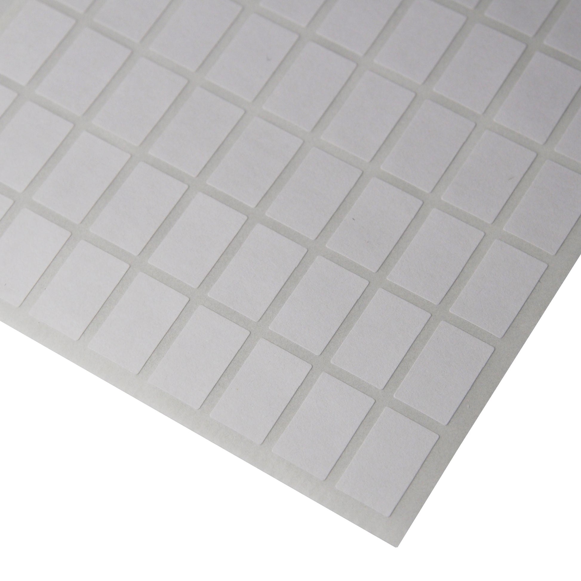 Corner of a sheet of Small Rectangular Self Adhesive Plain Labels - 1080 Labels/Pack (5/16" x 1/2")
