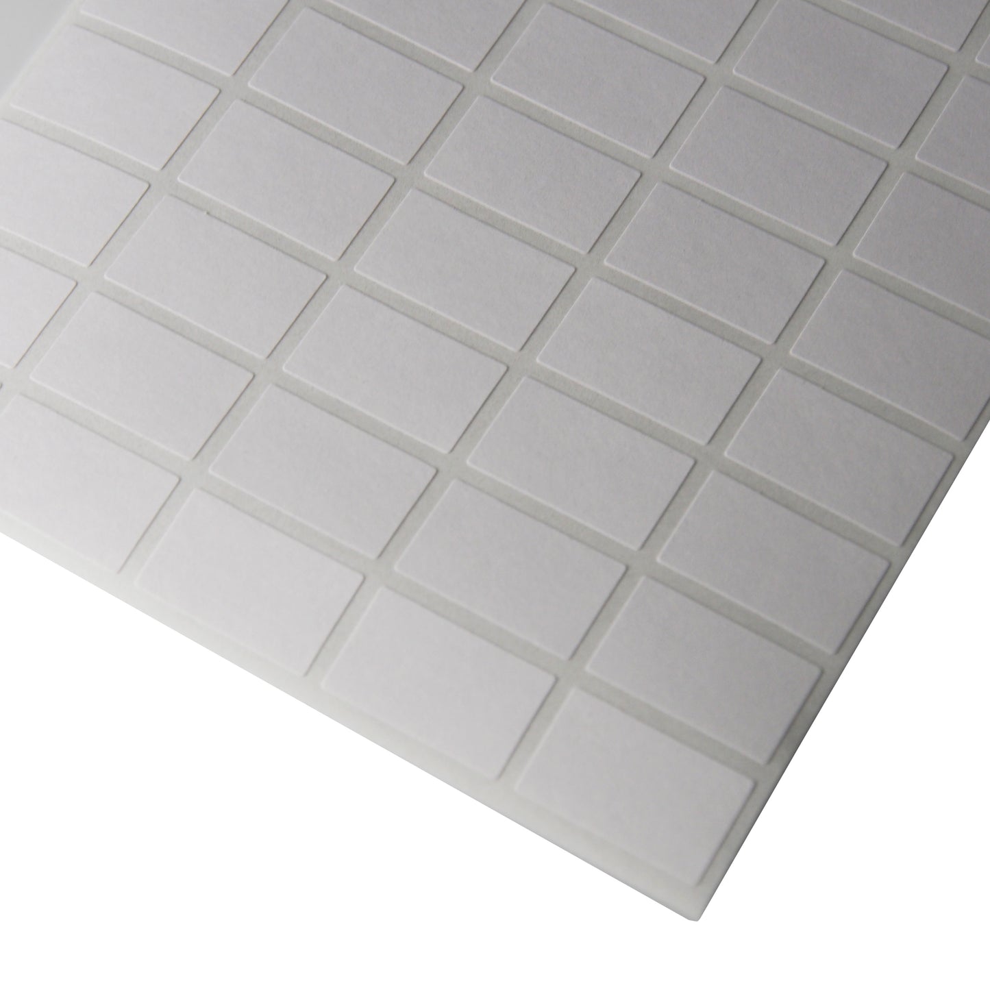 Corner of a sheet of Rectangular Self Adhesive Plain Labels - 1080 Labels (3/8" x 5/8")