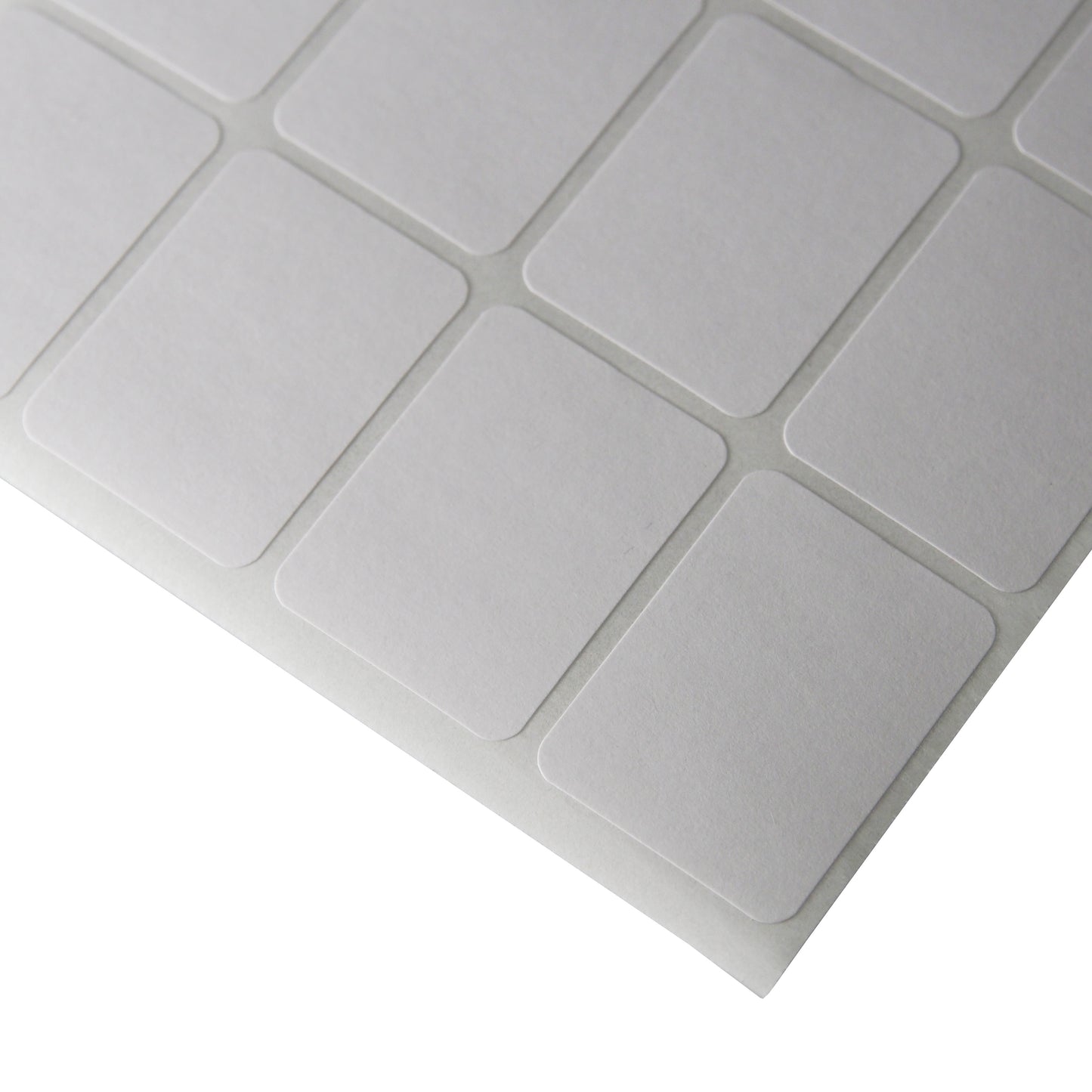 Corner of a sheet of Rounded Edge Rectangular Self Adhesive Plain Labels - 1000 Labels/Pack (3/4" x 1")